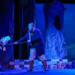 leading milky white cow